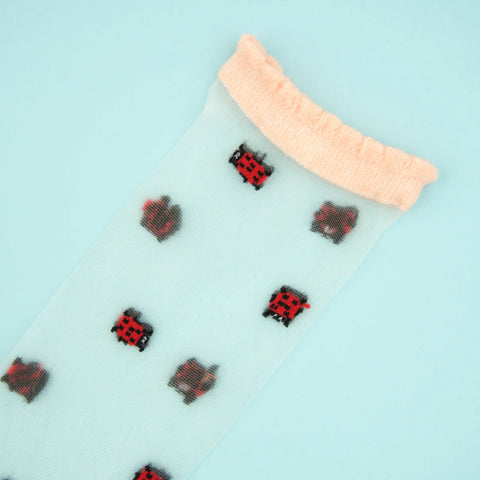 CHAUSSETTES TRANSPARENTES - COCCINELLE